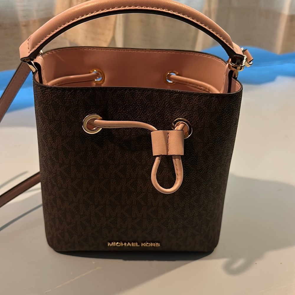 Pink and Brown MK purse. No scratches, Can be used as a crossbody purse as well.